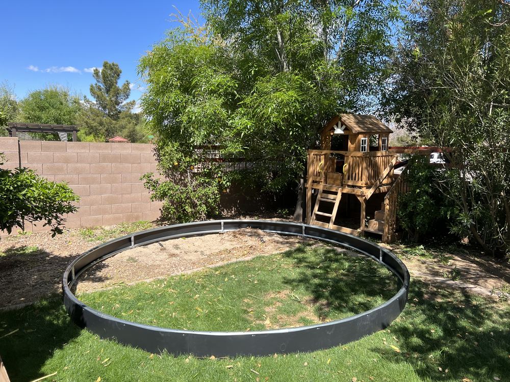 Marking the trampoline location in the backyard