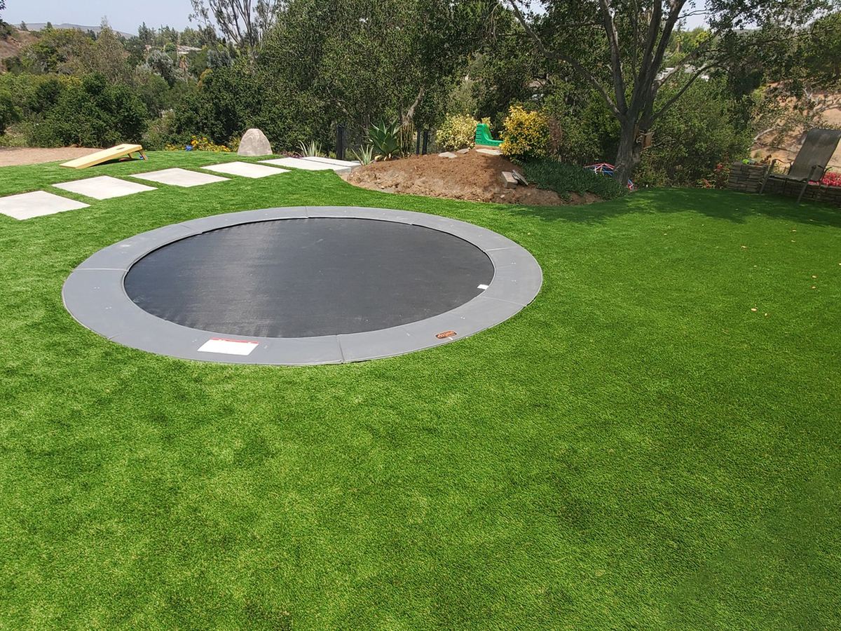 14 foot round in-ground trampoline set in artificial turf
